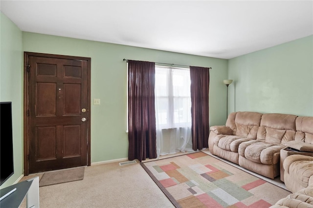 living room with light colored carpet and baseboards