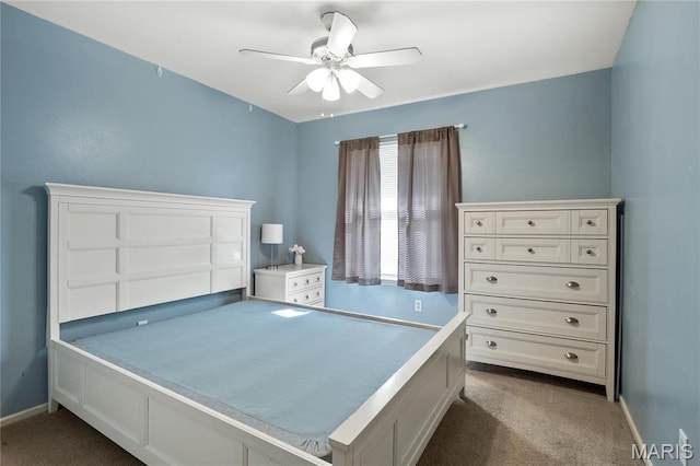 12063 Trampe Heights Ln, Saint Louis, MO 63138 - bedroom with dark colored carpet, baseboards, and a ceiling fan