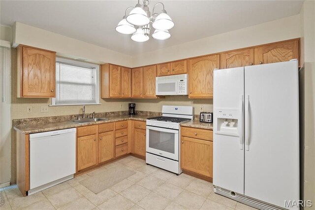 12063 Trampe Heights Ln, Saint Louis, MO 63138 - kitchen with white appliances, a sink, a chandelier, backsplash, and decorative light fixtures