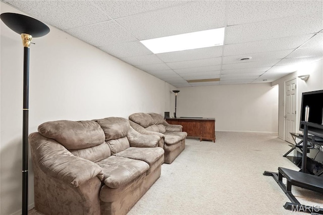 12063 Trampe Heights Ln, Saint Louis, MO 63138 - living room featuring light colored carpet, a drop ceiling, and baseboards