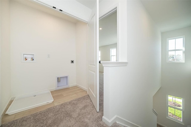 laundry room featuring electric dryer hookup, healthy amount of natural light, hookup for a washing machine, and carpet floors