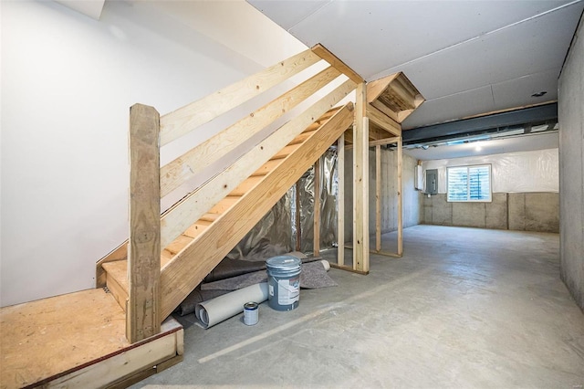 basement featuring electric panel