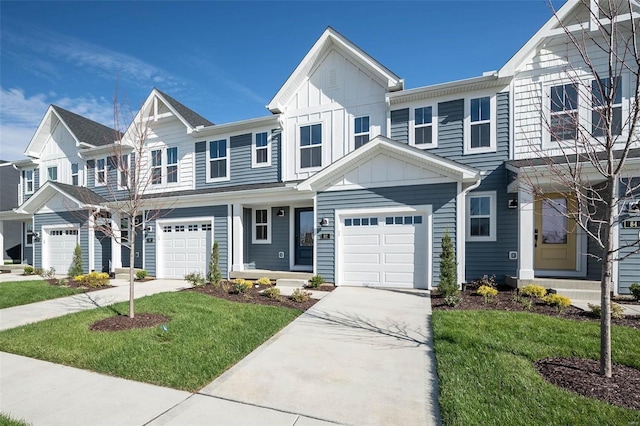 multi unit property featuring board and batten siding, driveway, a garage, and a front lawn