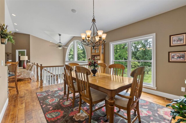 472 Ridgefield Dr, Cape Girardeau, MO 63701 - dining room with light wood-style flooring, a chandelier, baseboards, ceiling fan, and lofted ceiling