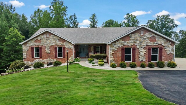 472 Ridgefield Dr, Cape Girardeau, MO 63701 - view of front facade featuring a front lawn, asphalt driveway, stone siding, and roof with shingles