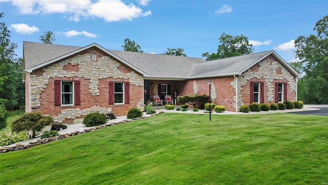 472 Ridgefield Dr, Cape Girardeau, MO 63701 - view of front of property featuring a front lawn, roof with shingles, and stone siding