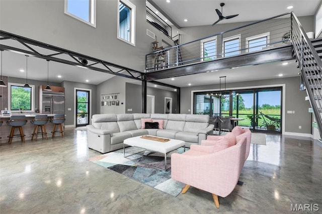 173 Tate Rdg, Cape Girardeau, MO 63701 - living area featuring a towering ceiling, recessed lighting, and concrete flooring
