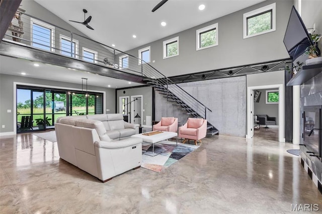 173 Tate Rdg, Cape Girardeau, MO 63701 - living room with a towering ceiling, stairway, ceiling fan, healthy amount of natural light, and recessed lighting