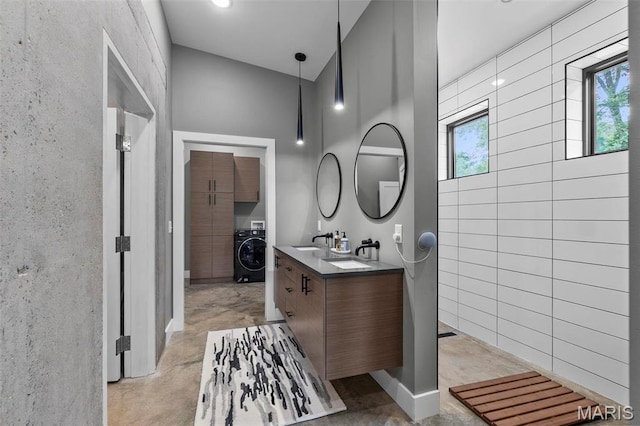 173 Tate Rdg, Cape Girardeau, MO 63701 - bathroom featuring washer / clothes dryer and double vanity