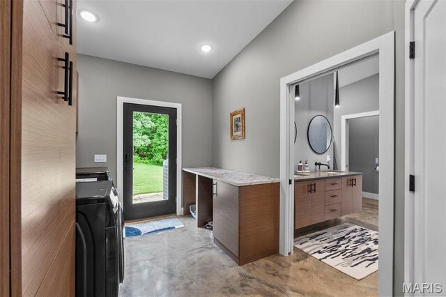 173 Tate Rdg, Cape Girardeau, MO 63701 - doorway featuring washer and clothes dryer, concrete flooring, and recessed lighting