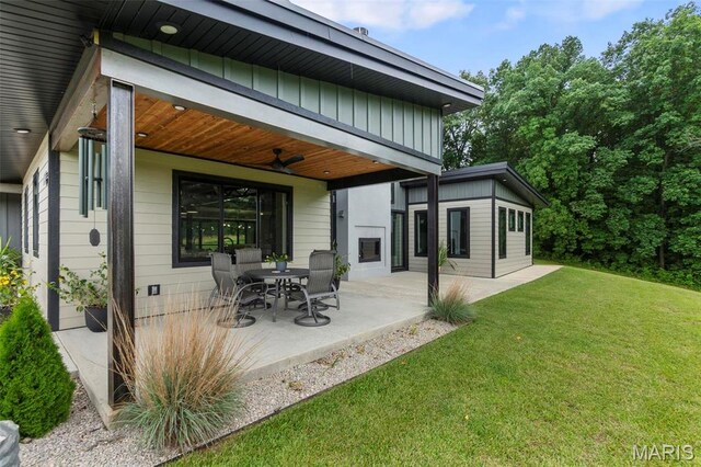 173 Tate Rdg, Cape Girardeau, MO 63701 - rear view of property featuring ceiling fan, a lawn, and a patio