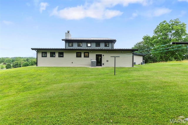 173 Tate Rdg, Cape Girardeau, MO 63701 - back of property featuring a chimney and a yard