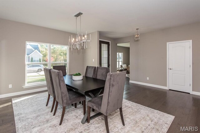 2708 Brook Hill Ln, Saint Charles, MO 63303 - dining room with a chandelier, wood finished floors, and baseboards