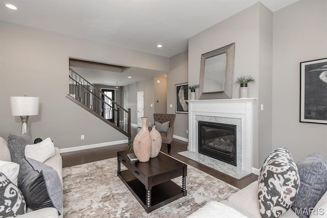 2708 Brook Hill Ln, Saint Charles, MO 63303 - living area with wood finished floors, stairway, baseboards, recessed lighting, and a premium fireplace