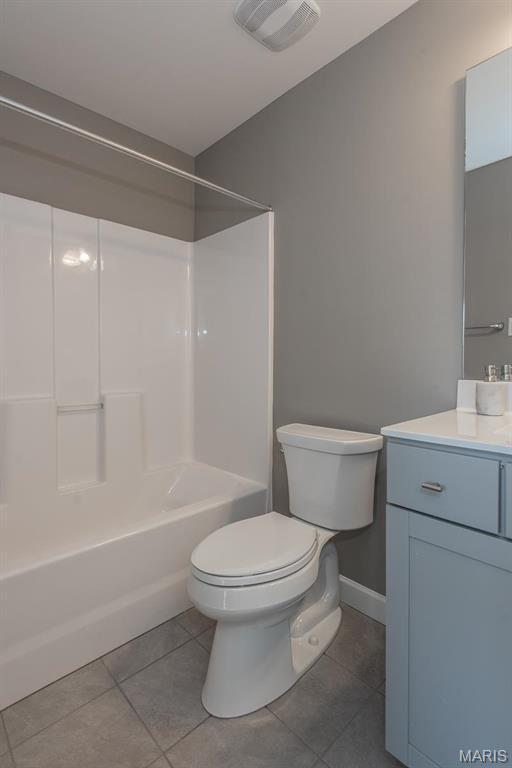 2708 Brook Hill Ln, Saint Charles, MO 63303 - full bath with tile patterned floors, toilet, vanity, and bathtub / shower combination