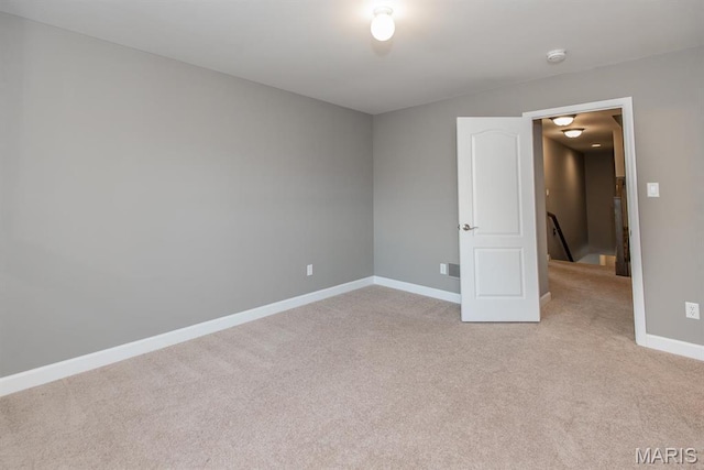 2708 Brook Hill Ln, Saint Charles, MO 63303 - spare room with light carpet, baseboards, and a smoke detector