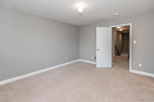 2708 Brook Hill Ln, Saint Charles, MO 63303 - unfurnished room with light colored carpet, baseboards, and a smoke detector