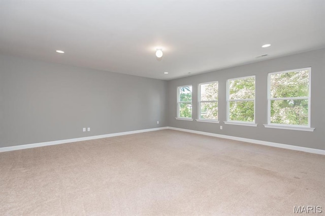 2708 Brook Hill Ln, Saint Charles, MO 63303 - spare room featuring light colored carpet, baseboards, and recessed lighting