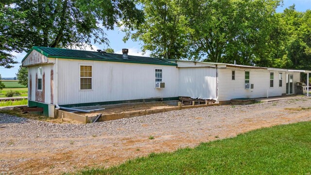 10912 State Highway 77, Chaffee, MO 63740 - back of property with metal roof and cooling unit