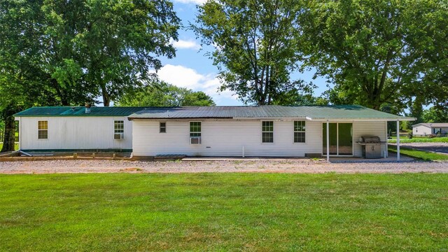 10912 State Highway 77, Chaffee, MO 63740 - back of property featuring metal roof and a yard