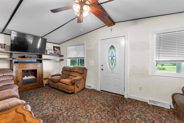 10912 State Highway 77, Chaffee, MO 63740 - living area featuring carpet, ceiling fan, a textured wall, a fireplace, and baseboards