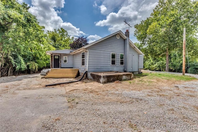 40 Kassebaum Ln, Saint Louis, MO 63129 - view of front of home with a chimney and a deck