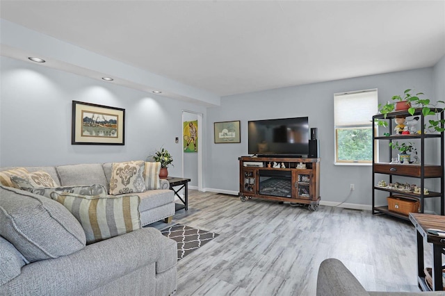 7102 Shadow Ln, Villa Ridge, MO 63089 - living room featuring wood finished floors, baseboards, and recessed lighting