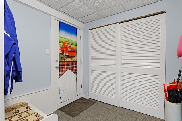 7102 Shadow Ln, Villa Ridge, MO 63089 - doorway to outside with dark colored carpet and a drop ceiling