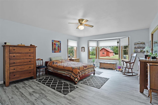 7102 Shadow Ln, Villa Ridge, MO 63089 - bedroom with wood finished floors and ceiling fan