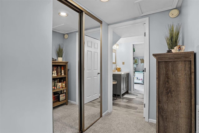 7102 Shadow Ln, Villa Ridge, MO 63089 - hallway with attic access, light carpet, baseboards, and recessed lighting