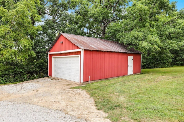 7102 Shadow Ln, Villa Ridge, MO 63089 - detached garage with view of scattered trees