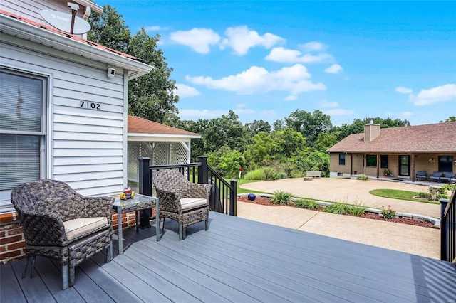 7102 Shadow Ln, Villa Ridge, MO 63089 - wooden terrace featuring a patio