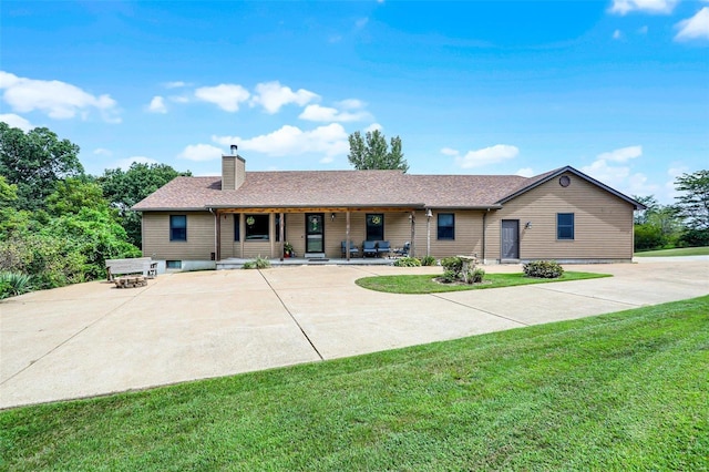 7102 Shadow Ln, Villa Ridge, MO 63089 - single story home with a front yard, a chimney, covered porch, and a shingled roof