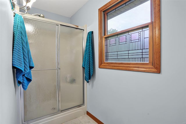 7102 Shadow Ln, Villa Ridge, MO 63089 - bathroom with a shower with door and baseboards