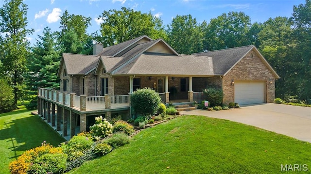 304 Timberlake Ln, Cape Girardeau, MO 63701 - view of front of house featuring a porch, an attached garage, concrete driveway, a front yard, and brick siding