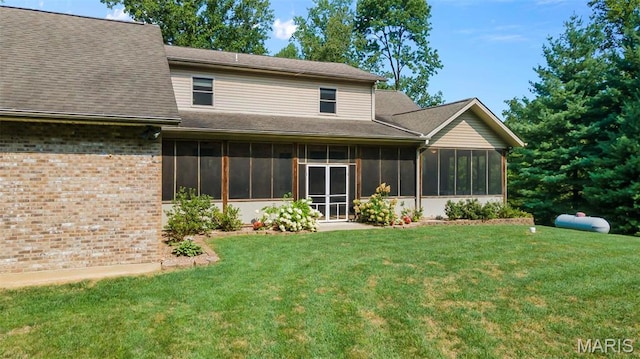 304 Timberlake Ln, Cape Girardeau, MO 63701 - rear view of property featuring a sunroom, a lawn, and brick siding