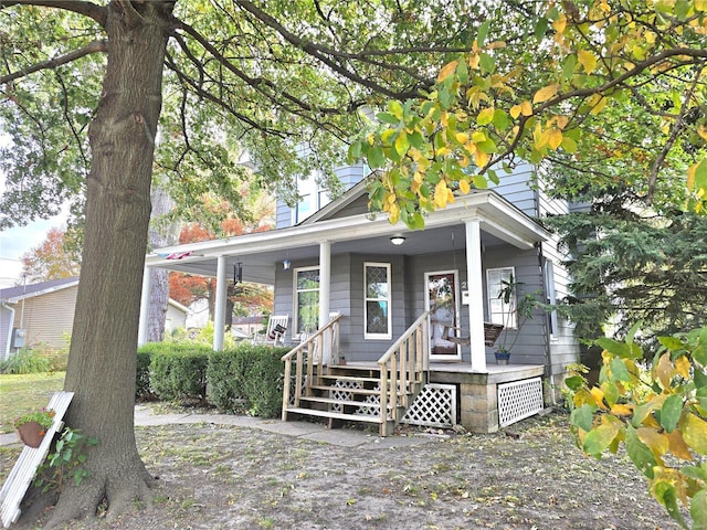 view of front of house with a porch and a chimney