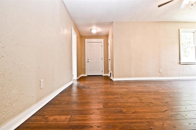 791 N Adams Ave N, Lebanon, MO 65536 - unfurnished room featuring hardwood / wood-style flooring, baseboards, a ceiling fan, and a textured wall