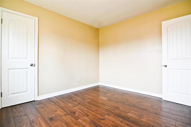 791 N Adams Ave N, Lebanon, MO 65536 - empty room featuring dark wood finished floors and baseboards