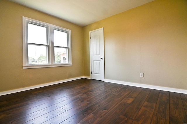 791 N Adams Ave N, Lebanon, MO 65536 - spare room featuring dark wood-style floors and baseboards