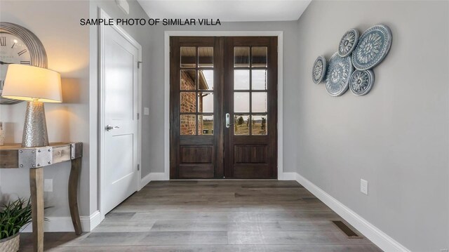 2411 Sunset Ridge Dr, Columbia, IL 62236 - entryway featuring baseboards and wood finished floors