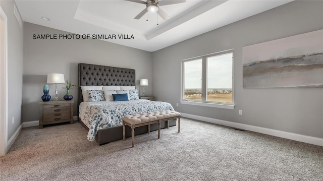 2411 Sunset Ridge Dr, Columbia, IL 62236 - carpeted bedroom featuring a tray ceiling, baseboards, and a ceiling fan