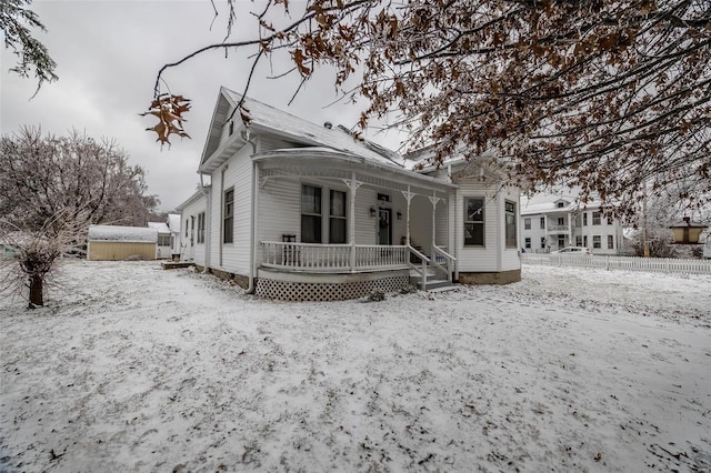 607 N Jackson St, Salem, MO 65560 - view of front of home with covered porch, a storage unit, and an outdoor structure