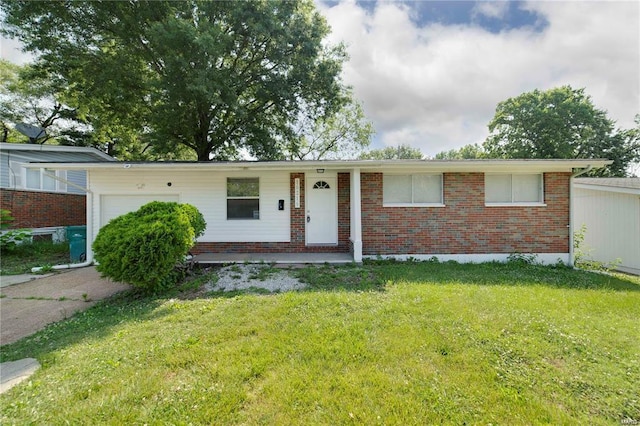 10216 Viscount Dr, Saint Louis, MO 63136 - single story home featuring an attached garage, brick siding, and a front lawn