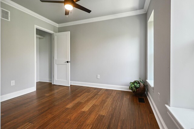 5640 Maple Ave, Saint Louis, MO 63112 - unfurnished bedroom featuring dark wood-style floors, ornamental molding, baseboards, and a ceiling fan