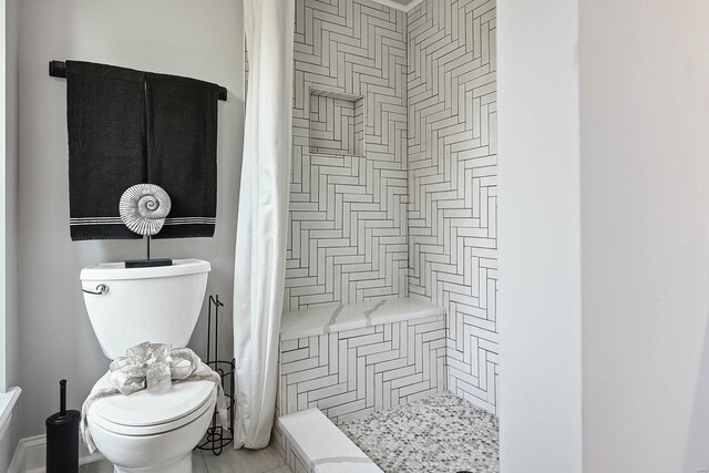 5640 Maple Ave, Saint Louis, MO 63112 - full bath featuring toilet, a shower stall, and tile patterned floors