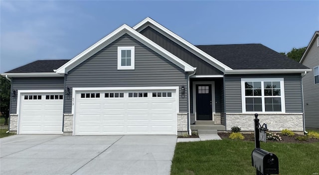 4947 Butler Hill Rd, Saint Louis, MO 63128 - view of front facade with stone siding, driveway, an attached garage, and a front lawn