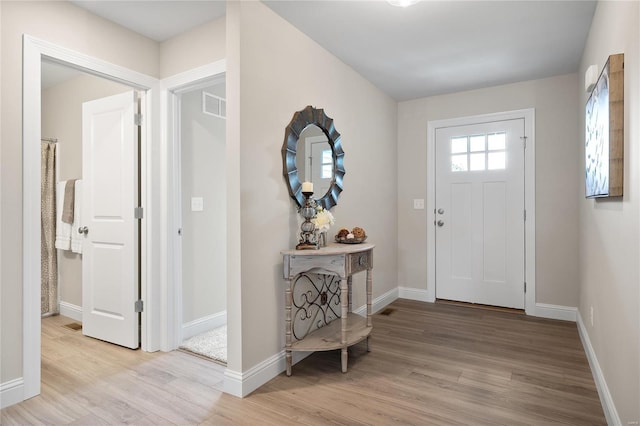 4947 Butler Hill Rd, Saint Louis, MO 63128 - foyer with light wood finished floors and baseboards
