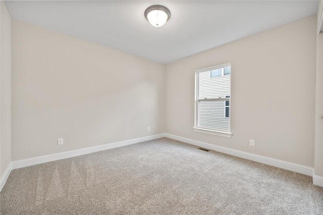 4947 Butler Hill Rd, Saint Louis, MO 63128 - carpeted spare room featuring baseboards