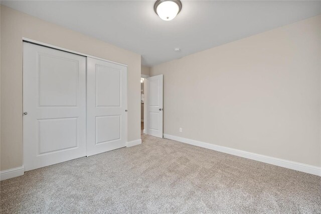 4947 Butler Hill Rd, Saint Louis, MO 63128 - unfurnished bedroom with carpet, a closet, and baseboards